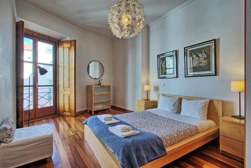 Postel nebo postele na pokoji v ubytování MyPlaceLisbon - Cais de Alfama Apartment