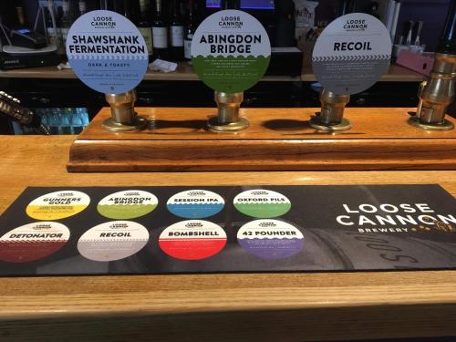 a display with different colored labels on a shelf at The Volunteer Inn in Wantage