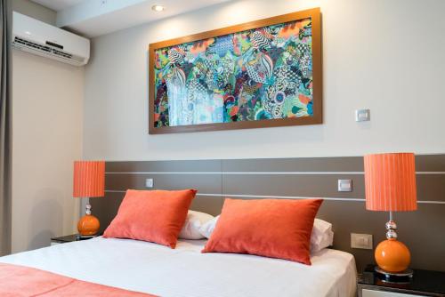 Ένα ή περισσότερα κρεβάτια σε δωμάτιο στο Sofia Soberana Hotel Boutique