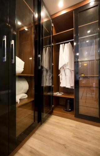 a walk in closet with a glass door at BBQ HOSTEL in Ha Long