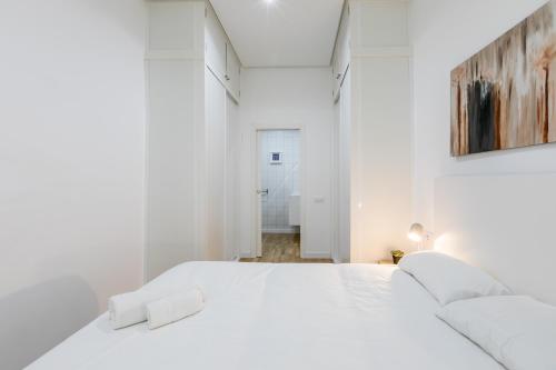 Un pat sau paturi într-o cameră la Loft Candela