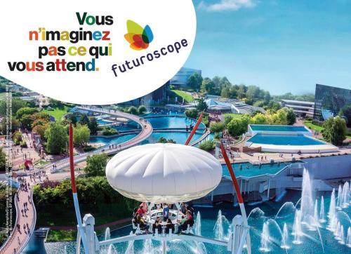 a ride in an amusement park with a fountain at appartement dans le thouarsais in Thouars