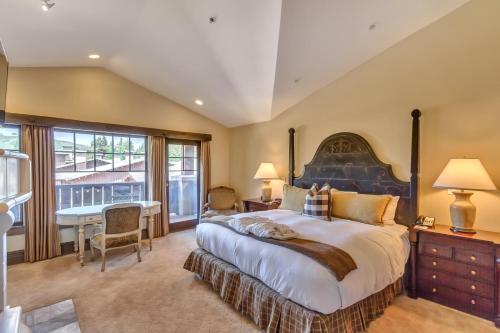 a bedroom with a large bed with a large window at The Chateaux Deer Valley in Park City