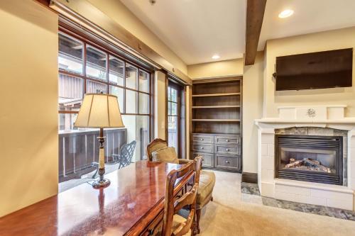 a dining room with a table and a fireplace at The Chateaux Deer Valley in Park City