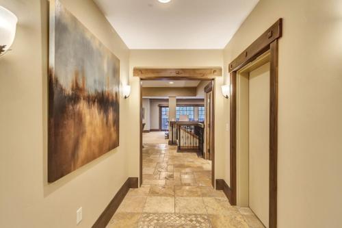 a hallway with a painting on the wall at The Chateaux Deer Valley in Park City