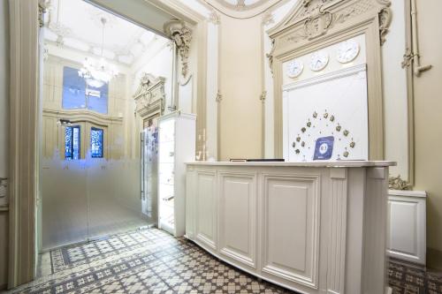 a hallway with a counter in a room with a door at Modern Art Hotel in Lviv