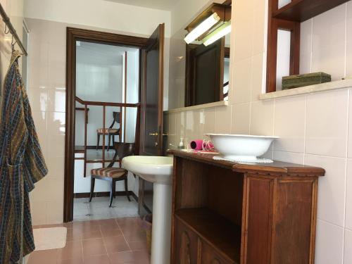 a bathroom with a sink and a mirror at Sea20.20 in Imperia