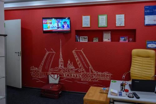 a wall with a drawing of the eiffel tower at Гостевой Дом "Bravo" на Казанской in Saint Petersburg