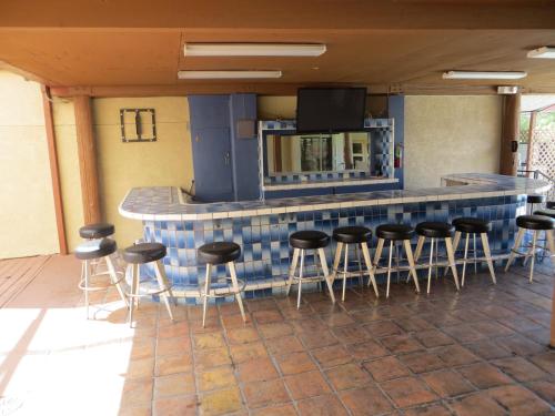 a kitchen area with a table and chairs at Saddle West Casino Hotel in Pahrump