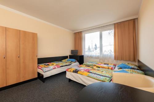 Postel nebo postele na pokoji v ubytování Hotel Buly