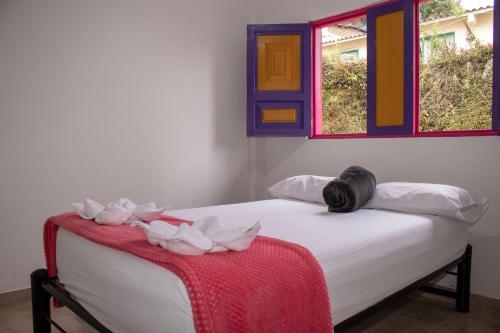 Cama o camas de una habitación en Hostal Palmas De Cocora
