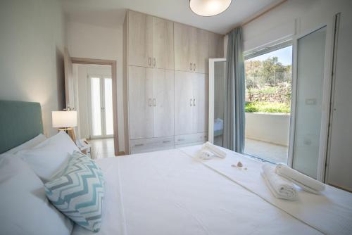 Posteľ alebo postele v izbe v ubytovaní Elounda Dream House