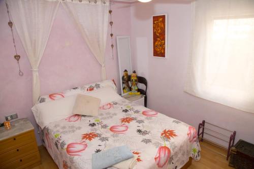 Rúm í herbergi á Habitación Maria Jose