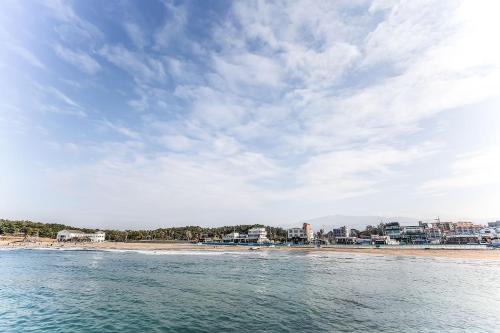 a view of the beach from the water at Jeju Ocean Family Hotel in Jeju