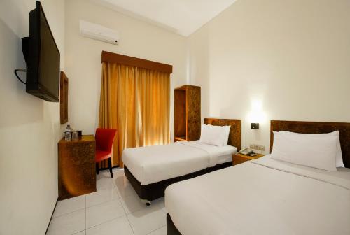 Cama o camas de una habitación en Ciptaningati Hotel