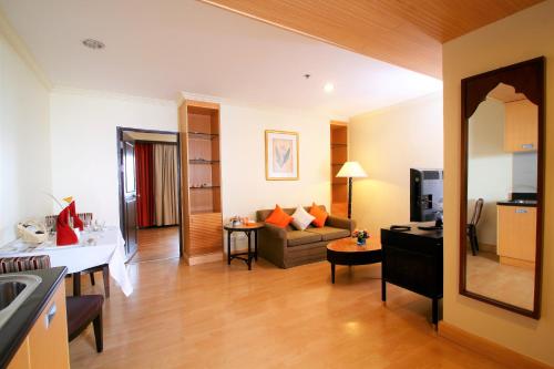 a living room with a couch and a table at Princeton Bangkok in Bangkok