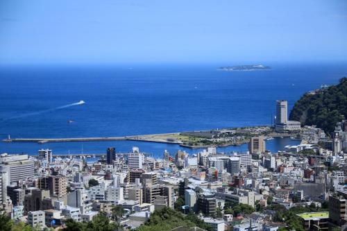 an aerial view of a city and the ocean at Atami Fuga in Atami