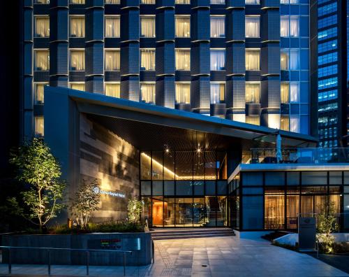an external view of a building at night at Daiwa Roynet Hotel Nishi-Shinjuku PREMIER in Tokyo