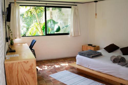 Tempat tidur dalam kamar di Coyoacan City Lofts