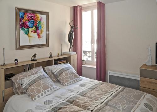 מיטה או מיטות בחדר ב-Gîte, location meublé de tourisme 3 étoiles