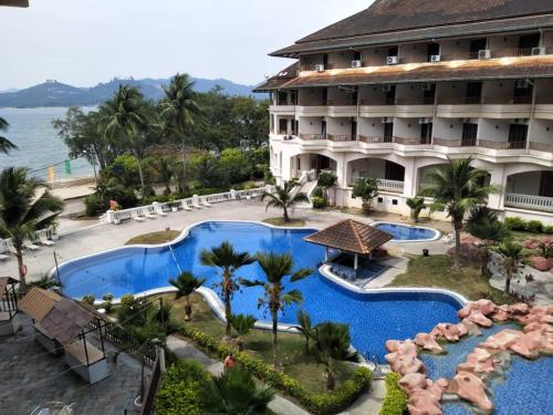 an aerial view of a resort with two pools at The Orient Star Resort Lumut in Lumut