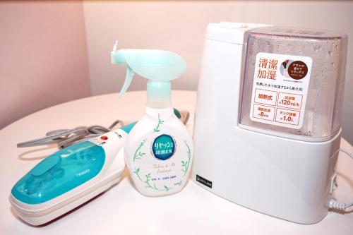 a bottle of hand soap next to a blender at First Cabin Ichigaya in Tokyo