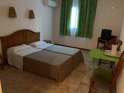 Postel nebo postele na pokoji v ubytování Apart'Hôtel Les 4 Sources