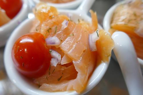 a bowl of food with a tomato and other foods at Hotel Villa Tummelchen in Cochem
