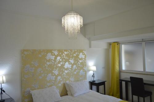 Uma cama ou camas num quarto em Tavira Vacations Apartments