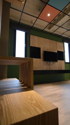 Una televisión o centro de entretenimiento en Chi Chu B&B