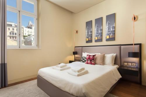 Katil atau katil-katil dalam bilik di Lisbon Finestay 8 Building Apartments