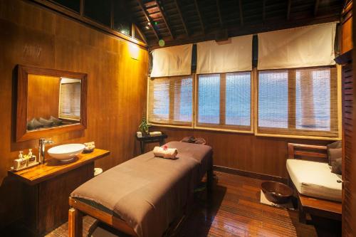 a bedroom with a bed and a sink in a room at Mount Lavinia Hotel in Mount Lavinia