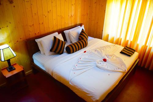 מיטה או מיטות בחדר ב-Blue Moon Hotel