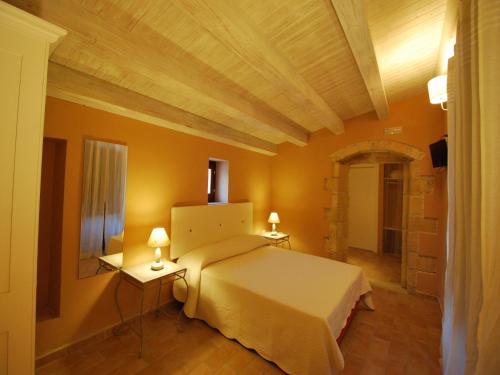 Ένα ή περισσότερα κρεβάτια σε δωμάτιο στο Pantanelli Di Vendicari