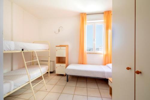 Residence Brezza di Mareにあるベッド