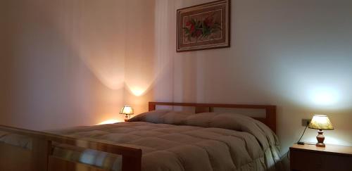 Postel nebo postele na pokoji v ubytování San Carlo - Terrazzo sul Mare con Ristorante e Pizzeria
