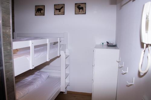 En eller flere senge i et værelse på Welcome in - Appartement met dakterras nabij skipiste