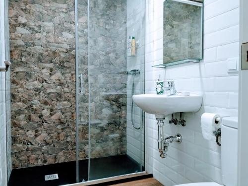 a bathroom with a sink and a shower at Loft Azahar junto a Puente Romano in Córdoba