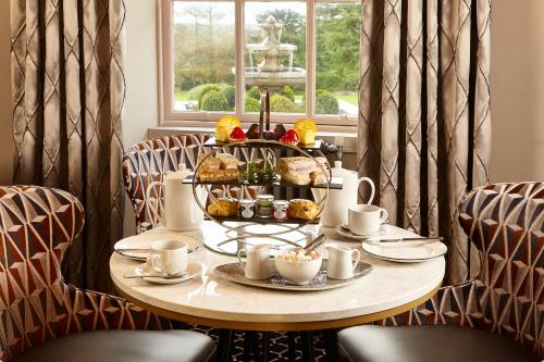 a table with a tray of food on top of it at Hetland Hall Hotel in Dumfries