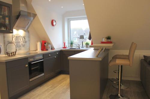 Kuchyň nebo kuchyňský kout v ubytování Appartement Geestblick