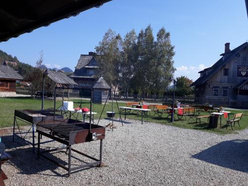 a playground with swings and tables in a park at Polana Sosny in Niedzica Zamek