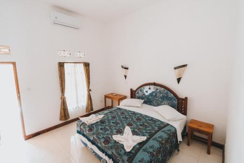 Postel nebo postele na pokoji v ubytování Mong Bungalows