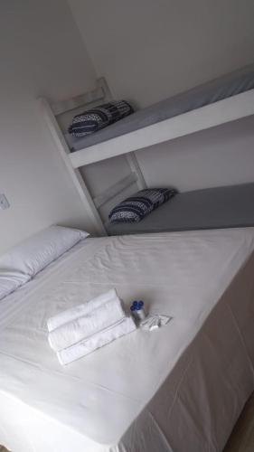 Postel nebo postele na pokoji v ubytování Pousada Petunia's