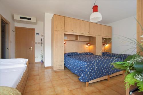 Ένα ή περισσότερα κρεβάτια σε δωμάτιο στο Hotel Garnì Villa Magnolia