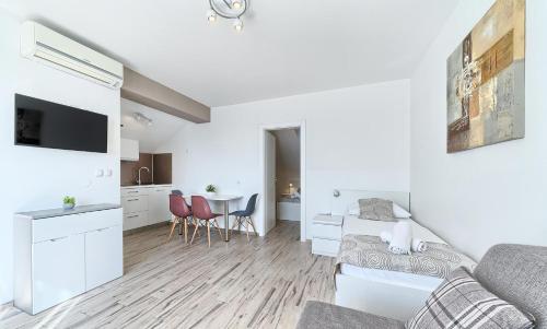 a living room with a couch and a table at Stipe Residence in Podstrana