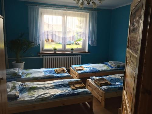 Posteľ alebo postele v izbe v ubytovaní Słoneczny Anioł