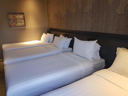 Postel nebo postele na pokoji v ubytování ibis Styles Makkah