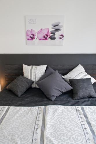 Postel nebo postele na pokoji v ubytování Loft Orchidee 2