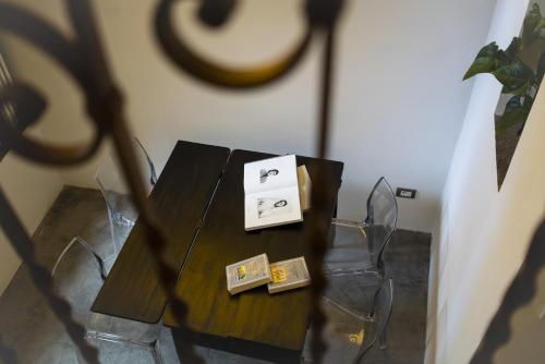 a table with two boxes on top of it at Due Residenze da Giò in Noto