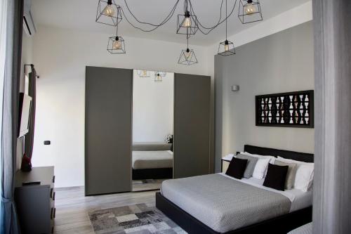 Krevet ili kreveti u jedinici u objektu Palazzo Mormando - Modern Apartment